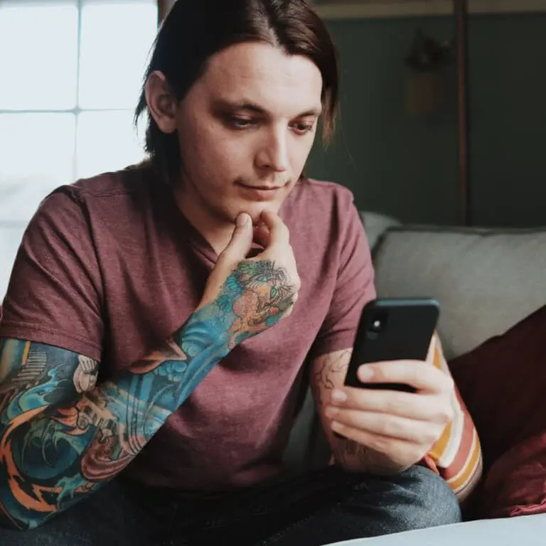 Person sat looking at their phone